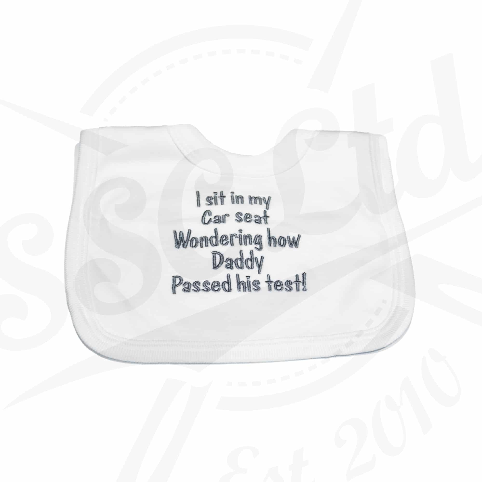 I sit in my car seat wondering how Daddy passed his test